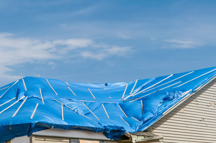 Roof tarp installation by P.J. Roofing, Inc