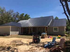Roof Installation with a Black 26 Gauge Rib Metal Which has an Energy-Efficient Rating in Crystal River, FL (2)